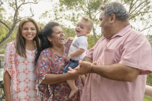 An Indigenous Australian family laughing together